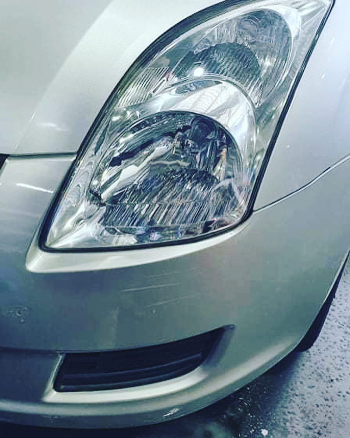 The same headlight lens, clear after polishing