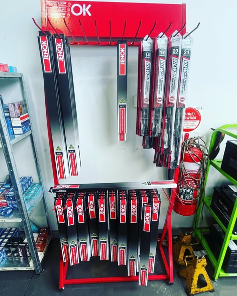 The Australian-made JENOK wiper blade rack in the LP Automotive parts area, stocked in sizes